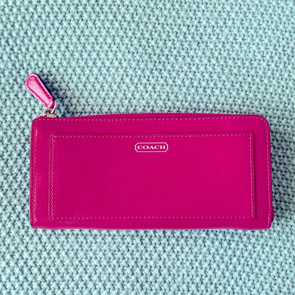 Dark pink Coach wallet with tan inside